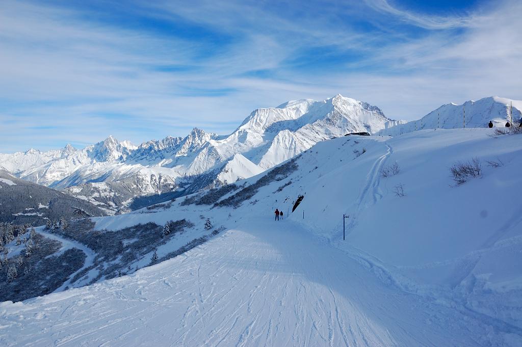 skiing down cat track in Megeve with a great view of the mountains