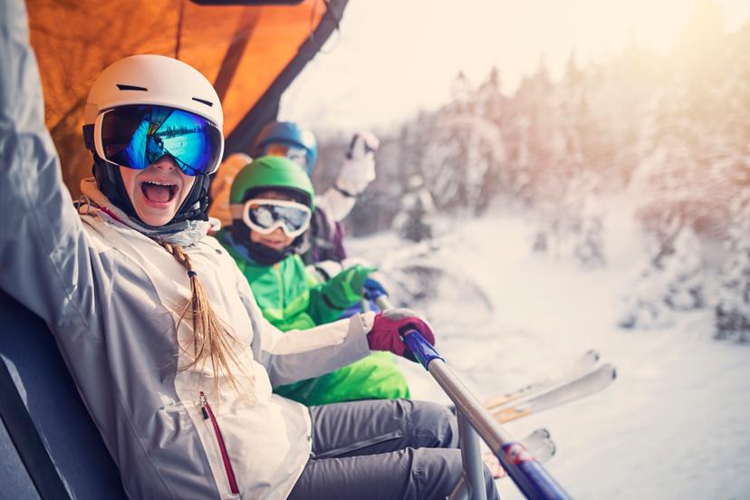 https://a.storyblok.com/f/150663/3864x2576/c66025c9d2/mother-with-kids-sitting-on-a-ski-lift.jpg