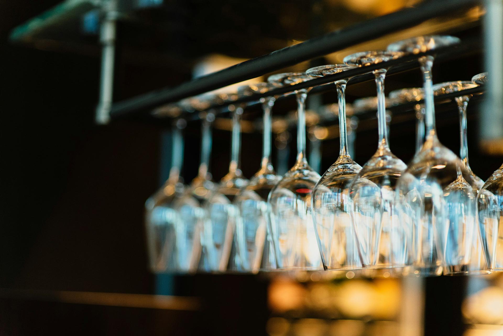 Wine-glasses-on-rack-at-ski-resort-bar